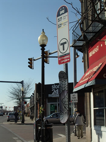 Photo of a skateboard afixed to a street sign