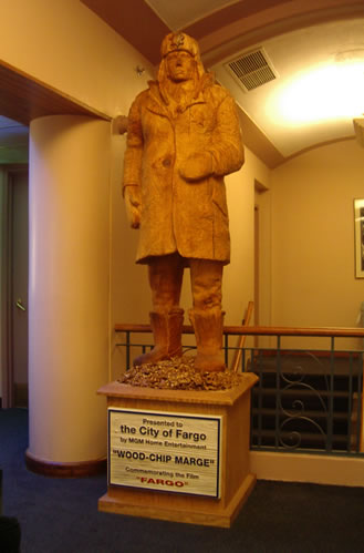 Photo of wood carved statue of Marge Gunderson from the movie Fargo