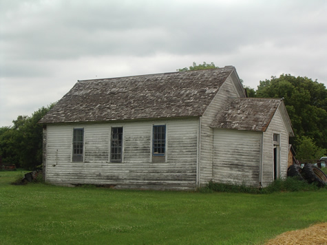 Photo of white one-room schoolhouse