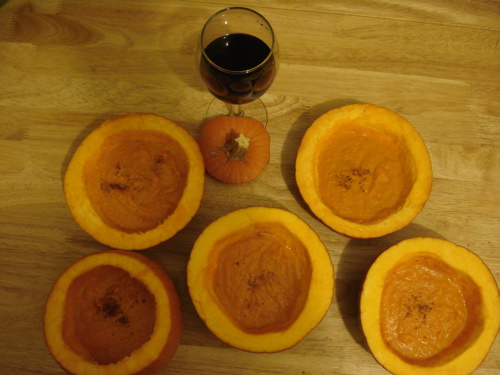 Images of carrot soup in pumpkin bowls